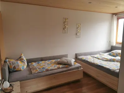 Ein Bett oder Betten in einem Zimmer der Unterkunft Bereuter