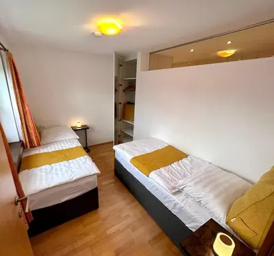 Ein Bett oder Betten in einem Zimmer der Unterkunft Negrelli Appartement