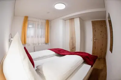 Ein Bett oder Betten in einem Zimmer der Unterkunft Rosis Ferienwohnung