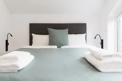 Ein Bett oder Betten in einem Zimmer der Unterkunft HŪSLE by UNIQUE PLACES - Stylische Tiny Houses in Vorarlberg
