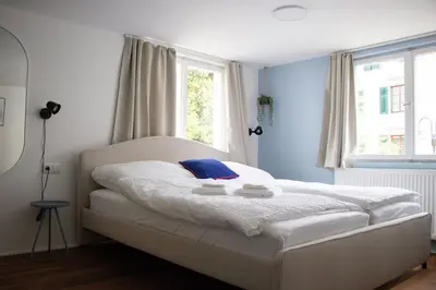 Ein Bett oder Betten in einem Zimmer der Unterkunft STADTHAUS M42 Dornbirn - Apartment Top 4