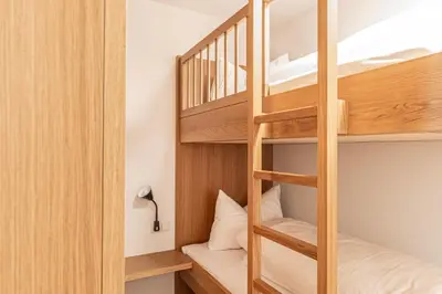 Ein Bett oder Betten in einem Zimmer der Unterkunft Berg Aparts Faschina - 03 - b42790