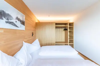 Ein Bett oder Betten in einem Zimmer der Unterkunft Berg Aparts Faschina - 11