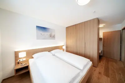 Ein Bett oder Betten in einem Zimmer der Unterkunft Berg Aparts Faschina - 08 - b42792