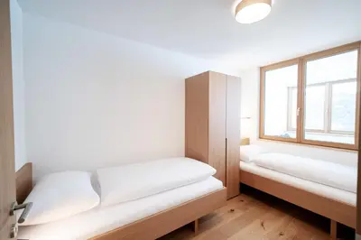 Ein Bett oder Betten in einem Zimmer der Unterkunft Berg Aparts Faschina - 08 - b42792