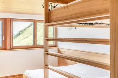 Ein Bett oder Betten in einem Zimmer der Unterkunft Berg Aparts Faschina - 13 - b42795