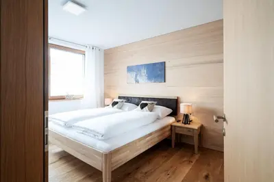 Ein Bett oder Betten in einem Zimmer der Unterkunft Berg Aparts Faschina - 02 - b42789