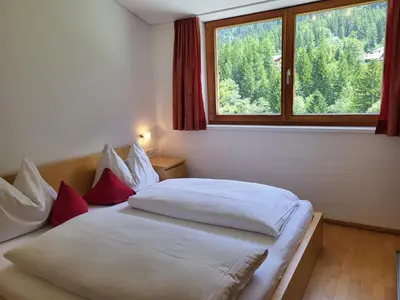 Ein Bett oder Betten in einem Zimmer der Unterkunft Top Appartements