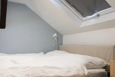 Ein Bett oder Betten in einem Zimmer der Unterkunft STADTHAUS M42 Dornbirn - Apartment Top 5