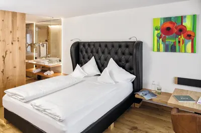 Ein Bett oder Betten in einem Zimmer der Unterkunft Fritsch am Berg - Adults only