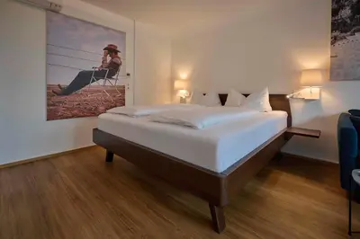 Ein Bett oder Betten in einem Zimmer der Unterkunft Design Studio Bergisel - KLIMATISIERT