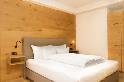 Ein Bett oder Betten in einem Zimmer der Unterkunft Heimat 1495m Appartement TYP 4