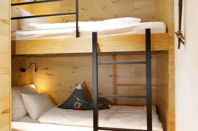 Ein Bett oder Betten in einem Zimmer der Unterkunft Heimat 1495m Appartement TYP 6