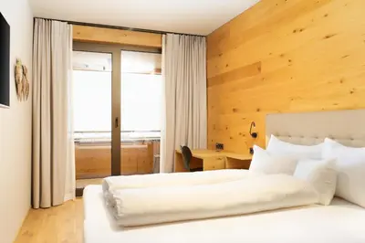 Ein Bett oder Betten in einem Zimmer der Unterkunft Heimat 1495m Appartements TYP 1