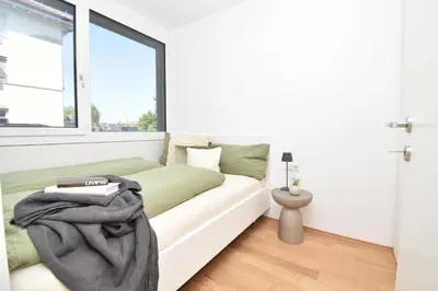 Ein Bett oder Betten in einem Zimmer der Unterkunft Ferienwohnung in Hard am Bodensee