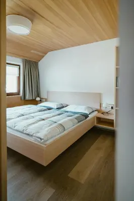 Ein Bett oder Betten in einem Zimmer der Unterkunft Haus Margreth