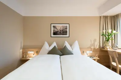 Ein Bett oder Betten in einem Zimmer der Unterkunft Hotel Johann
