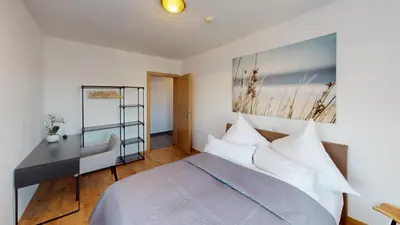 Ein Bett oder Betten in einem Zimmer der Unterkunft CROWN LIVING Design Apartment Dornbirn - zentral Gelegen, WLAN, kostenlosem Parkplatz und Self Check-in, ideal für Geschäftsreisende und Feriengäste