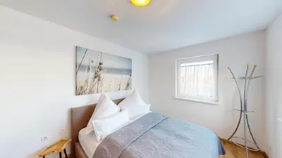 Ein Bett oder Betten in einem Zimmer der Unterkunft CROWN LIVING Design Apartment Dornbirn - zentral Gelegen, WLAN, kostenlosem Parkplatz und Self Check-in, ideal für Geschäftsreisende und Feriengäste