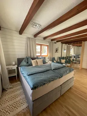 Ein Bett oder Betten in einem Zimmer der Unterkunft Ferienwohnung Jägerheim