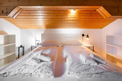 Ein Bett oder Betten in einem Zimmer der Unterkunft homy Alpine Deluxe Chalet in St Anton im Montafon