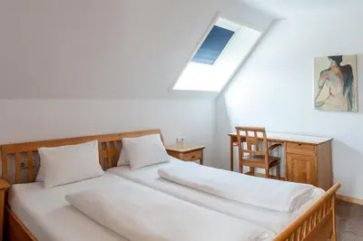 Ein Bett oder Betten in einem Zimmer der Unterkunft Gästehaus Brugger