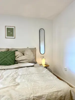 Ein Bett oder Betten in einem Zimmer der Unterkunft Stilvolles Wohnen am Hafen
