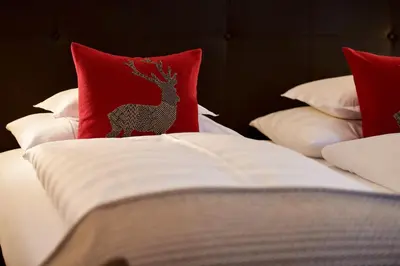 Ein Bett oder Betten in einem Zimmer der Unterkunft Hotel Garni Schneider