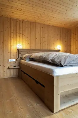 Ein Bett oder Betten in einem Zimmer der Unterkunft Berghof Ferienhaus