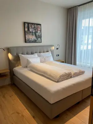 Ein Bett oder Betten in einem Zimmer der Unterkunft Heimat 1495m Appartement TYP 8