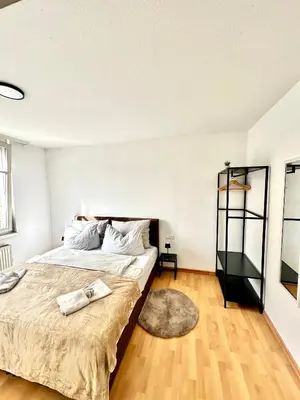 Ein Bett oder Betten in einem Zimmer der Unterkunft Ferienwohnung am Bregenzer Hafen