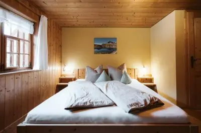 Ein Bett oder Betten in einem Zimmer der Unterkunft Naze`s Hus Mellau