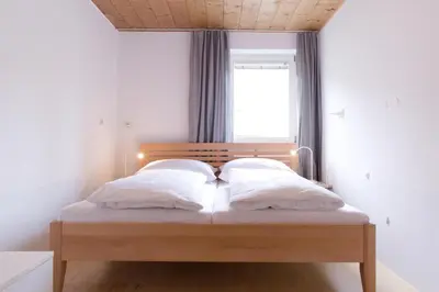 Ein Bett oder Betten in einem Zimmer der Unterkunft B31 - Ferienwohnung in Bezau