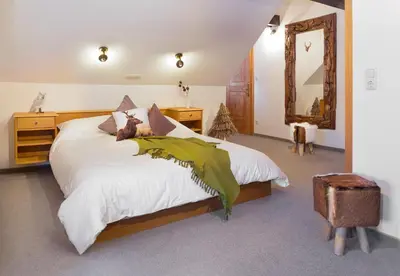 Ein Bett oder Betten in einem Zimmer der Unterkunft Bödele Alpenhotel