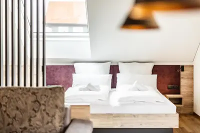 Ein Bett oder Betten in einem Zimmer der Unterkunft Alpen Krone by Maier - Dornbirn