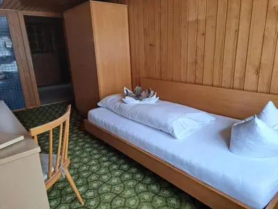 Ein Bett oder Betten in einem Zimmer der Unterkunft Familienfreundliches Bregenzerwälderhaus