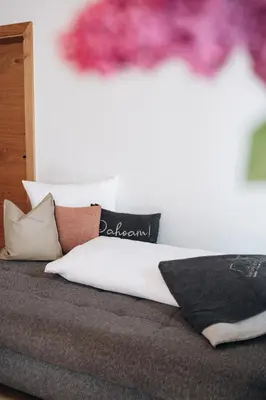 Ein Bett oder Betten in einem Zimmer der Unterkunft Rosa Alpina Appartement
