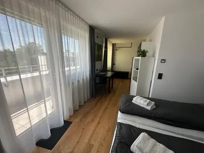 Ein Bett oder Betten in einem Zimmer der Unterkunft rs44 Apartments über den Dächern von Bregenz