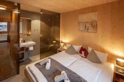 Ein Bett oder Betten in einem Zimmer der Unterkunft Eichen Lodge Mellau