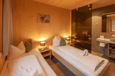 Ein Bett oder Betten in einem Zimmer der Unterkunft Eichen Lodge Mellau
