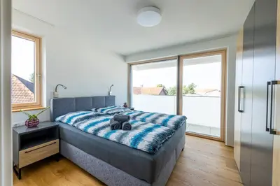 Ein Bett oder Betten in einem Zimmer der Unterkunft Bodensee Bergblick Suite