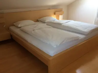 Ein Bett oder Betten in einem Zimmer der Unterkunft Ferienwohnung Allmein Top 3