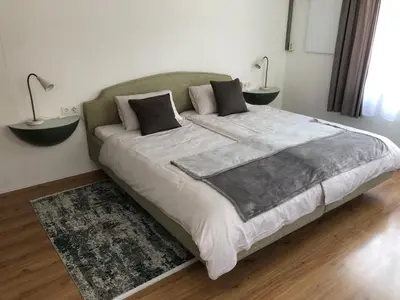 Ein Bett oder Betten in einem Zimmer der Unterkunft Ursprungshaus - Nuss und Traube