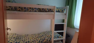 Ein Bett oder Betten in einem Zimmer der Unterkunft Familienfreundliche Wohnung Bregenz, Österreich