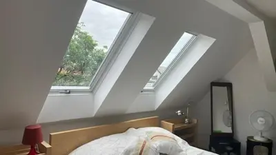 Ein Bett oder Betten in einem Zimmer der Unterkunft Dachwohnung im Villenviertel