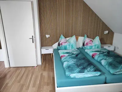 Ein Bett oder Betten in einem Zimmer der Unterkunft Apartment Anna mit Ladestation für E-Autos