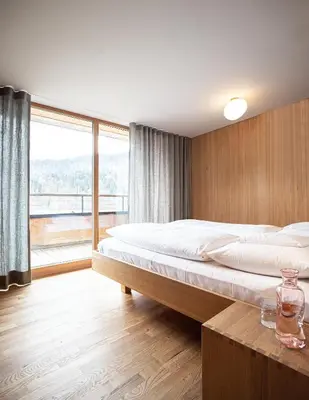 Ein Bett oder Betten in einem Zimmer der Unterkunft Biohotel Schwanen