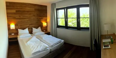 Ein Bett oder Betten in einem Zimmer der Unterkunft Hotel Café Schatz