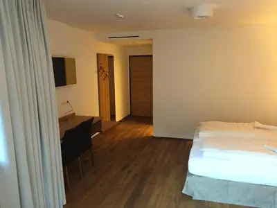 Ein Bett oder Betten in einem Zimmer der Unterkunft Hotel Café Schatz