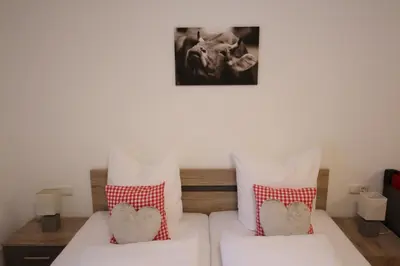 Ein Bett oder Betten in einem Zimmer der Unterkunft Monika-Mellau Appartements